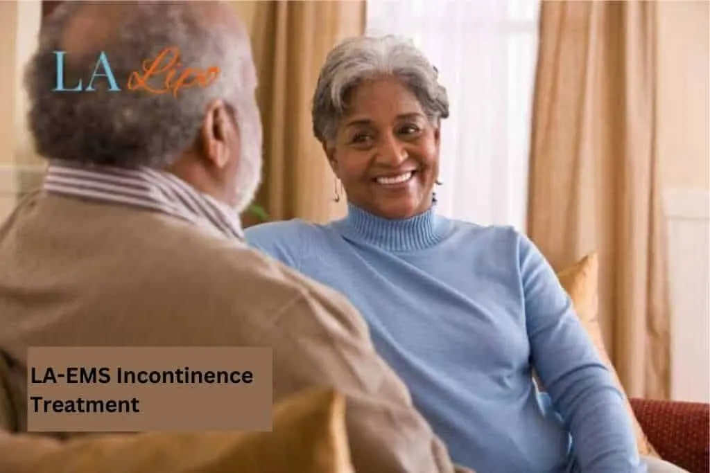 Couple sat smiling at each other - LA-EMS treatment Leicestershire